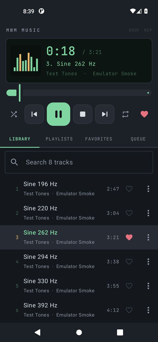 MWM Music playing a track: the display with clock and title, transport buttons, and the library list below